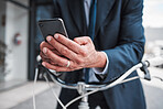 Phone, typing and hands of businessman with bicycle for travel, transport or directions to office, building or work in the city. Man, search and connection to internet with bike for journey in town