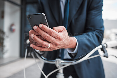 Buy stock photo Phone, typing and hands of businessman with bicycle for travel, transport or directions to office, building or work in the city. Man, search and connection to internet with bike for journey in town