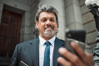 Buy stock photo Happy man, social media or lawyer with phone for news, legal services update or networking online. Smile, mature advocate or senior judge typing on website to scroll, chat or search outside a court 
