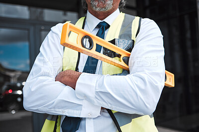 Buy stock photo Man, arms crossed and architect has level, construction and confident in city, maintenance and project management. Urban infrastructure, architecture and male contractor with tools and professional