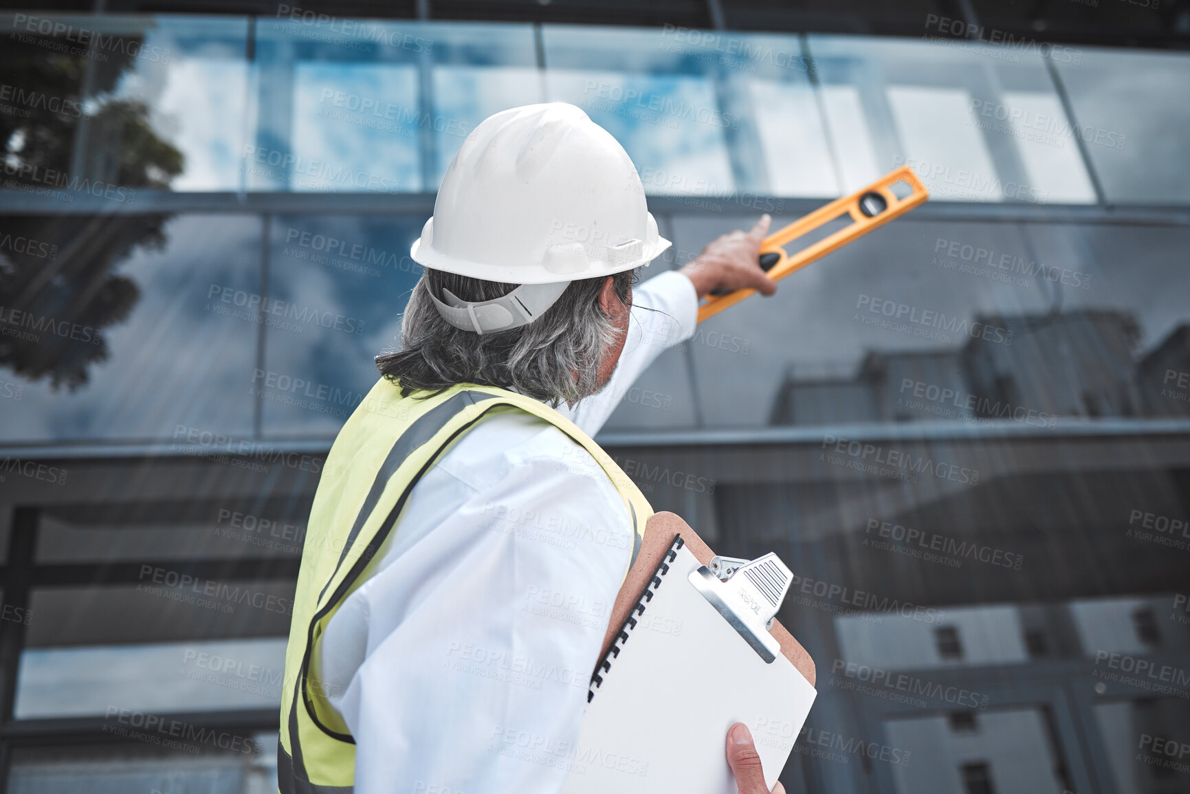 Buy stock photo Engineering, checklist and man with tools at construction site inspection, urban development or city project management. Manager or person from behind for outdoor architecture and clipboard survey