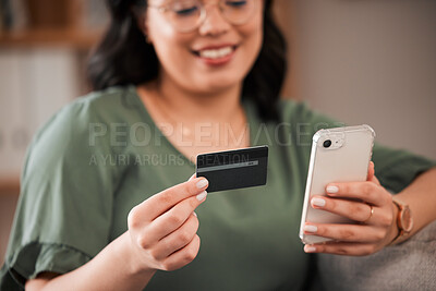 Buy stock photo Smile, woman and a credit card and phone for online shopping, banking app or ecommerce on the sofa. Happy, house and closeup of a girl with a mobile for retail, payment or online finance on the couch