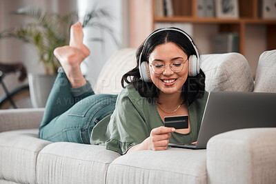 Buy stock photo Woman, credit card and headphones on computer online shopping, e learning and fintech payment on sofa. Student or person relax with music subscription, banking services and home education on laptop