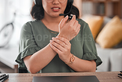 Buy stock photo Woman, hands and wrist pain in remote work from injury, typing or overworked by desk at home office. Closeup of female person or call center consultant with sore ache, joint or carpal tunnel syndrome