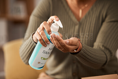 Buy stock photo Closeup, hands and a person with sanitizer for medical safety and security from virus in a house. Alcohol, clean and a woman with a bottle of disinfectant liquid in palm for healthcare while sick