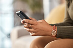 Woman, hands and typing on smartphone in home, reading social media notification or online contact. Closeup of female person with cellphone to download mobile games, search digital network or website