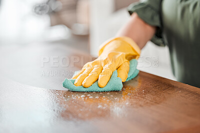 Buy stock photo Hands, cleaning and bacteria on a wooden table for hygiene, disinfection or to sanitize a surface in a home. Gloves, spray and product with a woman cleaner in the living room for housework or chores