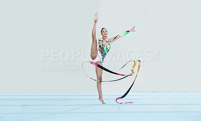 Buy stock photo Gymnastics training, woman and ribbon with legs split for competition, sport and balance in portrait. Gymnast, athlete girl or professional dancer for concert, performance and contest with creativity