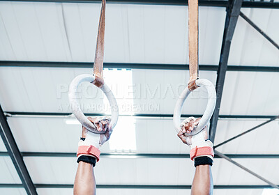 Buy stock photo Hands, gymnastics ring and person in fitness for workout, strength training or competition. Closeup of hanging athlete, strong gymnast or acrobat holding on balance circles for performance exercise