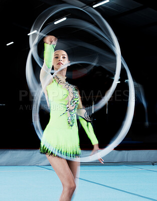 Buy stock photo Gymnastics, sports and woman with ribbon blur in gym for rhythmic body movement, training or exercise. Aerobics performance, health and portrait of female dancer for competition, practice and dance