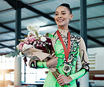 Woman, gymnastics and winner, medal and flower bouquet, happy with celebration and winning competition. Prize, reward and bonus, female champion on podium with gymnast and athlete smile with gift