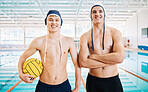 Sports, swimming and portrait of male athletes with crossed arms for confidence before a competition. Happy, smile and men swimmers with a ball standing by an indoor pool for a water match.