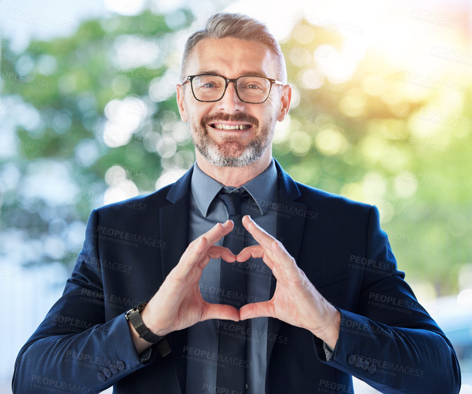 Buy stock photo Face, business man and ceo with heart hands outdoor for trust, care and happy. Portrait, mature with love sign, smile for kindness or empathy, charity or gratitude, romance emoji or support