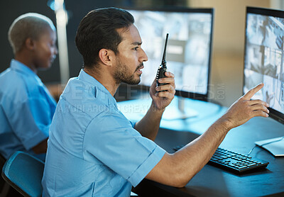 Buy stock photo Control room, safety and security guard with a radio and computer screen for surveillance. Man and woman team together for crime investigation, cctv monitor and communication with a walkie talkie