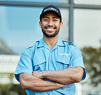 Asian man, portrait and security guard with arms crossed in city for career safety or outdoor protection. Male person, police or officer smile in confidence, law enforcement or patrol in urban town
