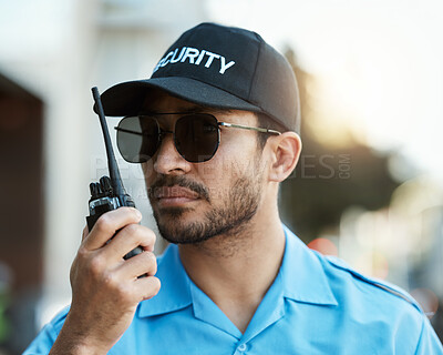 Buy stock photo Security guard, safety officer or man with a walkie talkie outdoor on a city road for communication. Serious face of person with a radio on urban street to report crime, investigation or surveillance