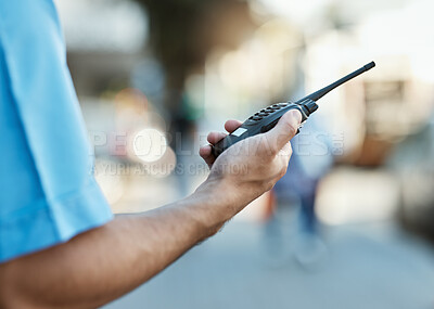 Buy stock photo Hand, walkie talkie and a security guard or safety officer outdoor on a city road for communication. Closeup of person with a radio on urban street to report crime for investigation and surveillance