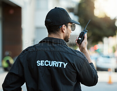 Buy stock photo Radio, man and a security guard or safety officer outdoor on a city road for communication. Back of a person with a walkie talkie on urban street to report crime for investigation and surveillance