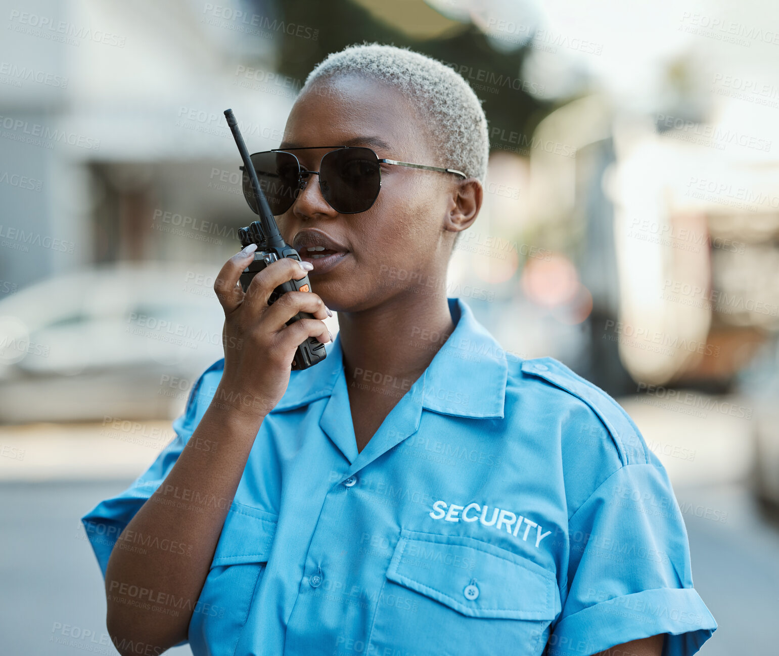 Buy stock photo Woman, radio and a security guard or safety officer outdoor on a city road for communication. Black person talking on walkie talkie on urban street to report crime for investigation and surveillance