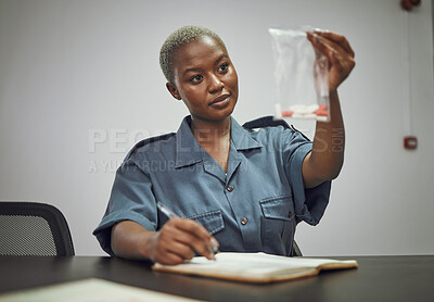 Buy stock photo Black woman, drugs and writing police report with evidence from crime, investigation or search in room. African female person, law enforcement or officer holding illegal pills or trace from criminal