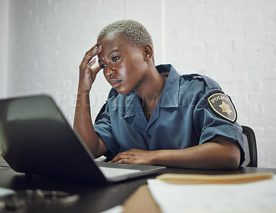 Buy stock photo Police, woman and headache from working with stress on computer or frustrated with case, report or anxiety in security. African, officer and tired from work on documents in office or station