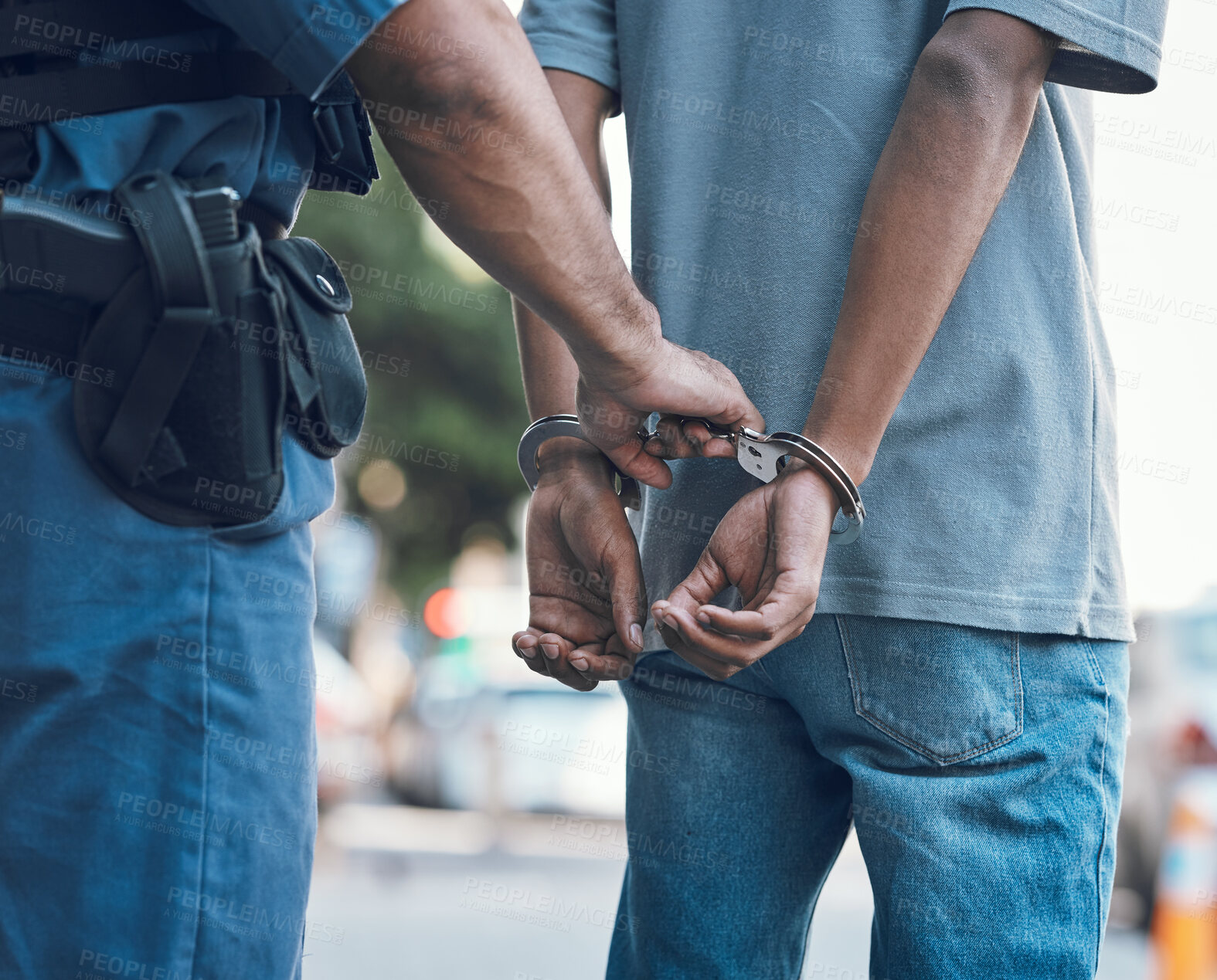 Buy stock photo Handcuffs, police and hands of police man with criminal in city for justice, crime or corruption. Illegal, arrest and law enforcement officer with suspect, thief or gangster for jail, robbery or fail