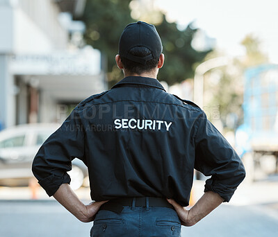 Buy stock photo Man, back and security guard in city for safety protection, law enforcement or outdoor emergency. Rear view of male person, police or officer standing ready for crime control to protect and serve