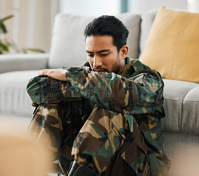 Buy stock photo Sad, trauma and male military soldier sitting on the floor in the living room of his house. Depression, ptsd and man army warrior from Mexico thinking about mental health in the lounge at home. 