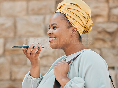 Buy stock photo Phone, voice recognition and woman in the city walking in an urban street to her office. Technology, happy and African female designer recording a message on cellphone while commuting in town road.