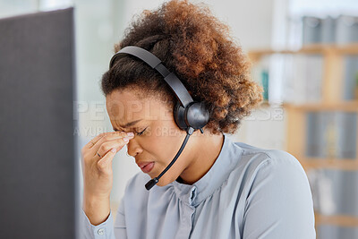 Buy stock photo Customer support, call center and woman with headache in office with tension, stress and pain. Telemarketing, business and overworked female person with burnout, strain and injury for crm service