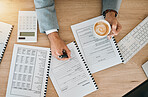 Top view, business and man writing, closeup and financial planning with paperwork, budget spreadsheet and cappuccino. Male person, accountant or broker with finance documents, investment or checklist