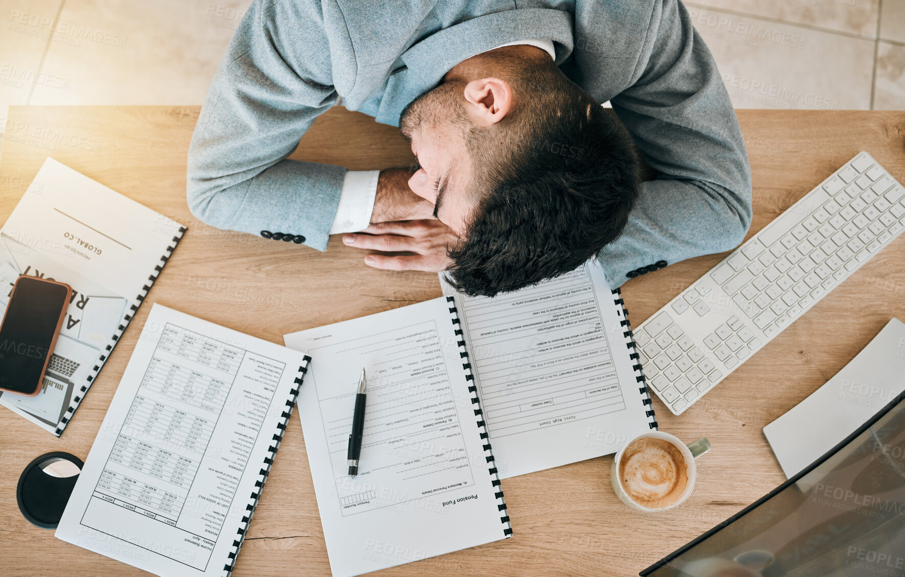 Buy stock photo Top view, burnout and tired or man with sleeping at desk and exhausted at finance job. Employee, depressed and rest on table at work with fatigue or accountant with stress in office with documents.
