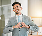 Portrait of businessman, heart hands and smile in office with confidence, opportunity and happiness at startup. Emoji, business and face of happy man with love hand gesture in professional workplace.