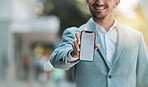Hand, blank phone screen and space in street with happy business man for app mockup, promotion or branding. Smartphone, entrepreneur and smile for ux, iot logo or mobile web design on metro sidewalk