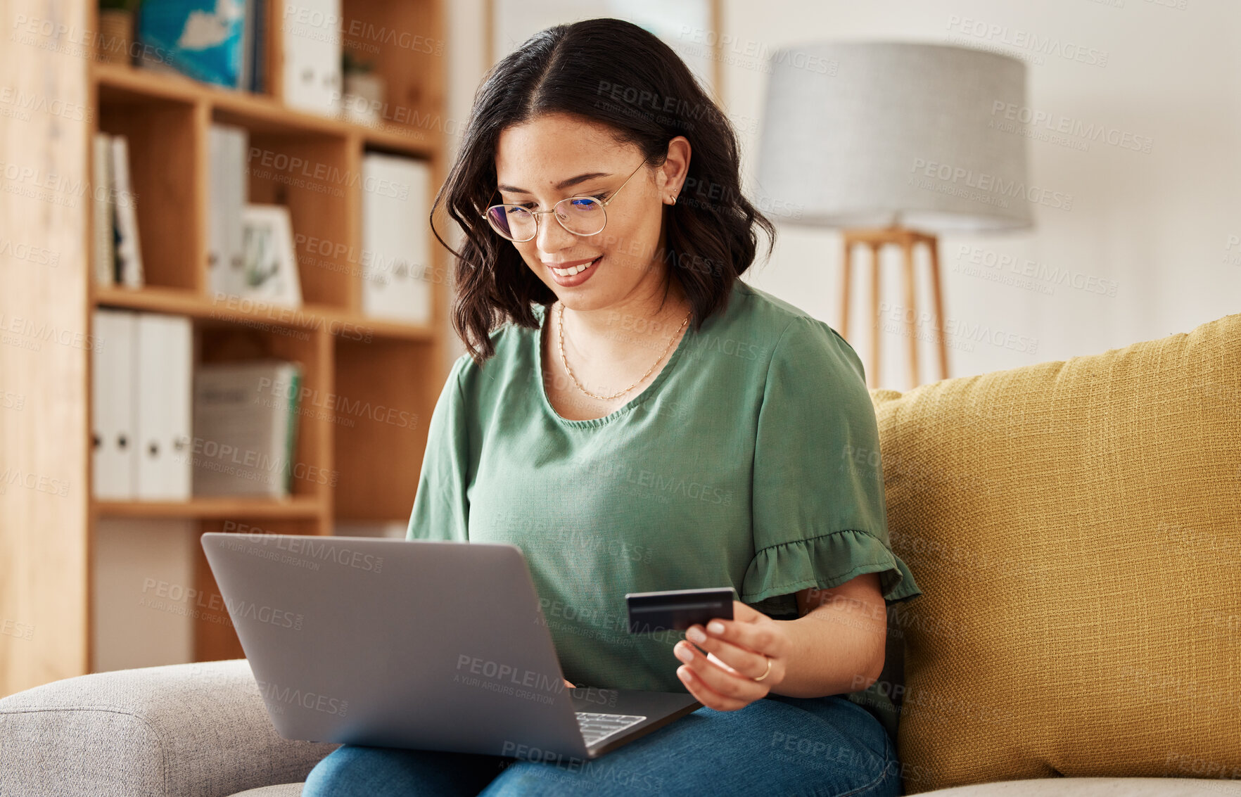 Buy stock photo Online shopping, laptop and credit card, happy woman on sofa in living room for internet banking app in home. Ecommerce payment, smile and cashback, girl with computer browsing retail website sale.