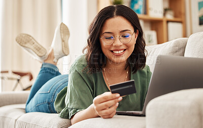 Buy stock photo Relax, laptop and credit card, happy woman on sofa in living room for internet banking in home for online shopping. Ecommerce payment, smile and cashback, girl on couch with computer and website sale