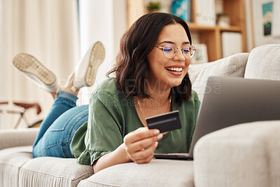 Buy stock photo Relax, laptop and credit card, happy woman on couch in living room for internet banking in home for online shopping. Ecommerce payment, smile and cashback, girl on sofa with computer and website sale