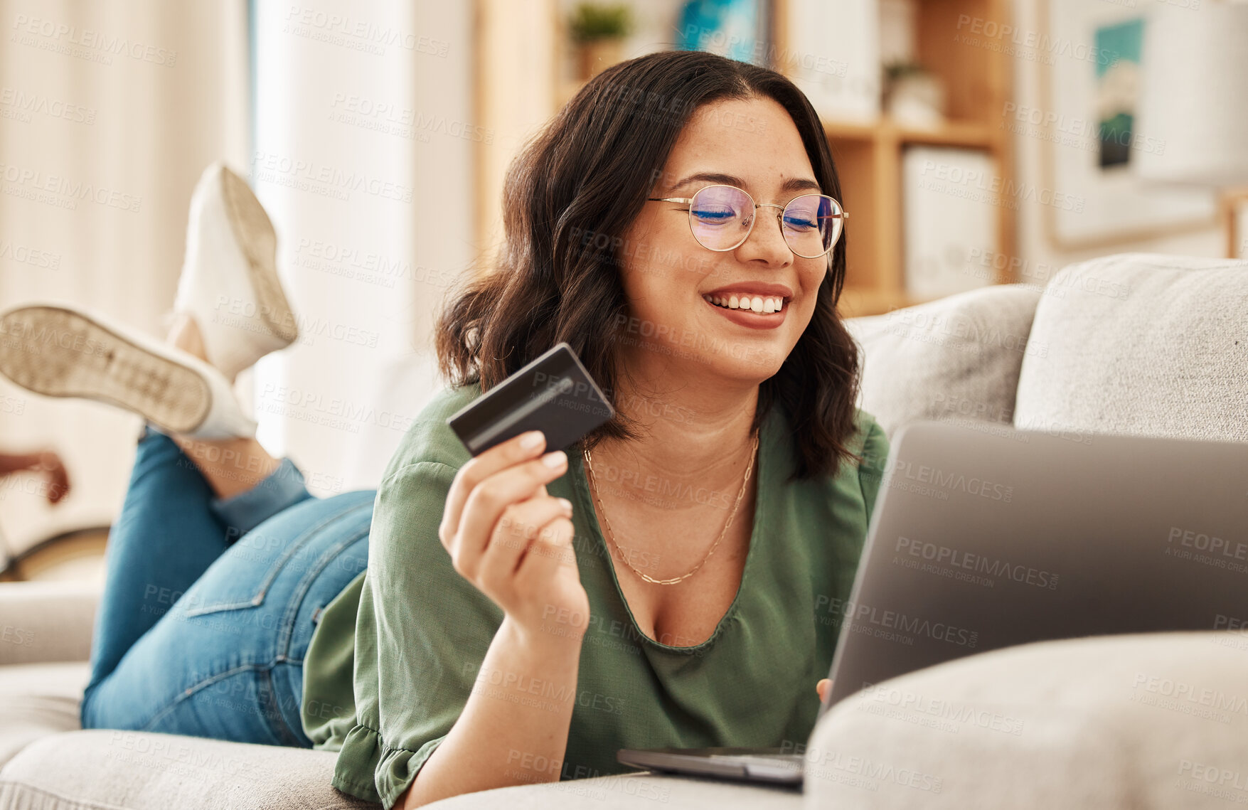 Buy stock photo Online shopping, relax and credit card, woman on sofa in living room for internet banking app in home with laptop. Ecommerce payment, smile and cashback, girl at computer browsing retail website sale