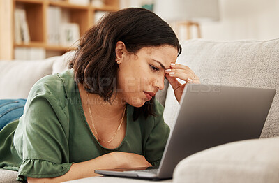 Buy stock photo Woman, home and headache with laptop and remote work stress on a sofa feeling frustrated. House, female person and confused from computer problem with anxiety from online website project on a couch