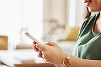 Hands of woman typing with cellphone in home for social media post, online chat or reading notification. Closeup of female person relax on smartphone, download mobile games or search digital network