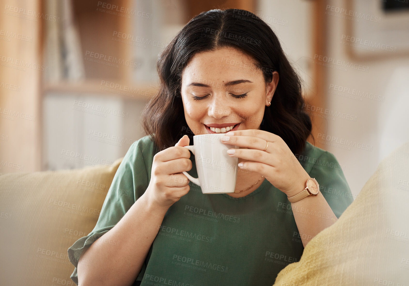 Buy stock photo Coffee, relax and smile with a woman in her home, sitting on a sofa in the living room enjoying a beverage. Peace, quiet and eyes closed with a happy young female person drinking tea in her house