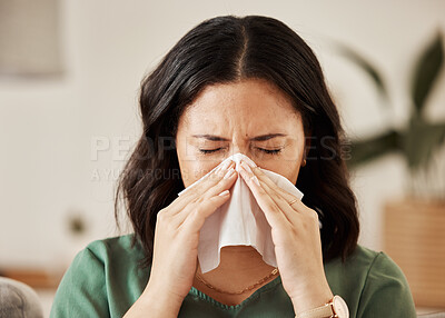 Buy stock photo Blowing nose, tissue and woman in a living room with flu, cold and hay fever, crisis or viral infection in her home. Sneezing, allergies and person with virus or coughing illness in a lounge in house