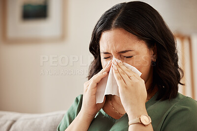 Tissue, nose and woman in a living room with flu, cold and hay fever, crisis or viral infection in her home. Sneezing, allergies and female with paper in a lounge, fever or coughing illness in house