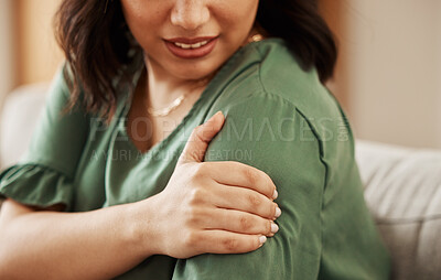 Buy stock photo Hands, shoulder pain and woman on sofa, massage or stress injury for burnout, emergency or health risk. Girl, arthritis or osteoporosis with fatigue, tired or accident in home living room on couch