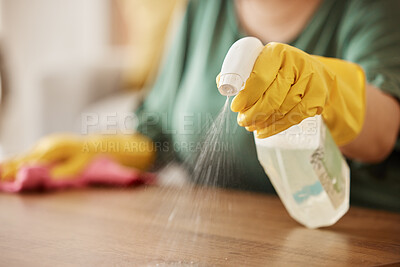 Buy stock photo Hand, spray bottle and a woman cleaning a wooden surface in her home for hygiene or disinfection. Gloves, product and bacteria with a female cleaner using detergent to spring clean in an apartment