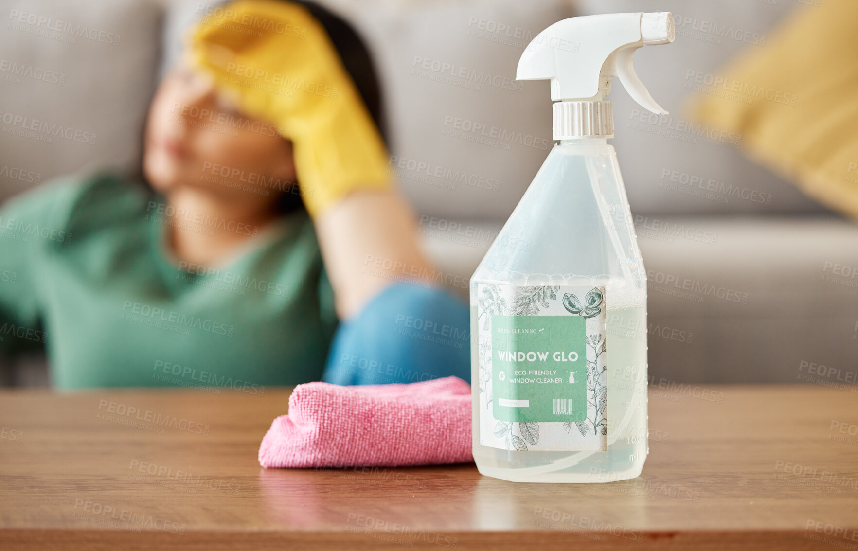 Buy stock photo Cleaning, tired and woman with spray bottle in living room for , housework and maid service. Furniture, housekeeping and exhausted, fatigued and burnout female person with detergent products for dirt