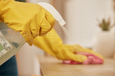 Buy stock photo Hand, spray and a woman cleaning a wooden surface in her home for hygiene or disinfection. Rubber gloves, product and bacteria with a female cleaner using detergent to spring clean in an apartment