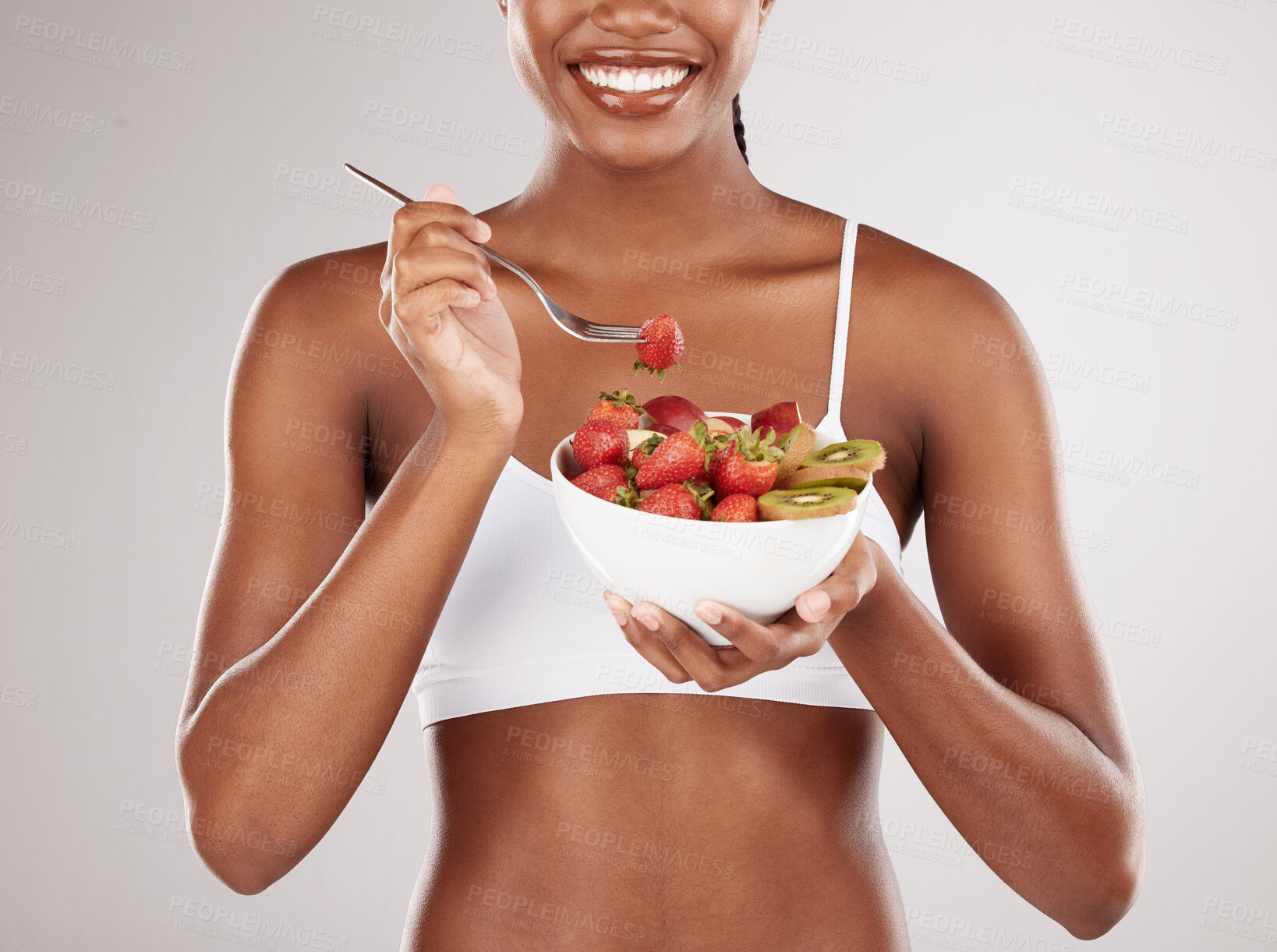 Buy stock photo Woman, hands and diet with fruit salad for natural nutrition against a white studio background. Closeup of female person holding bowl of organic strawberry and kiwi to lose weight or healthy wellness