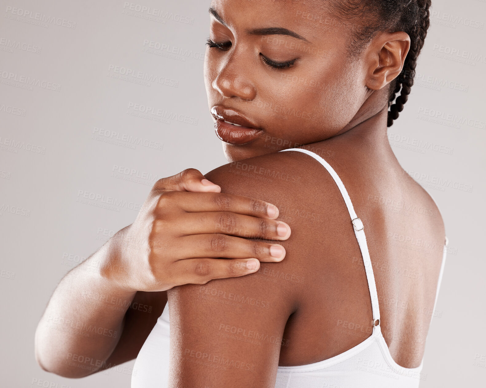 Buy stock photo Black woman, shoulder pain and injury with health risk, muscle tension and stress on a grey studio background. Female person, inflammation or model with joint strain, sore and swollen with body ache