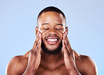 Beauty, skincare and cream on face of black man in studio for sunscreen, cosmetics and spa treatment. Facial, self care and dermatology with person on blue background for lotion, wellness and health